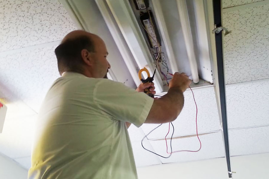 CMC Electric commercial electrician testing ceiling wiring