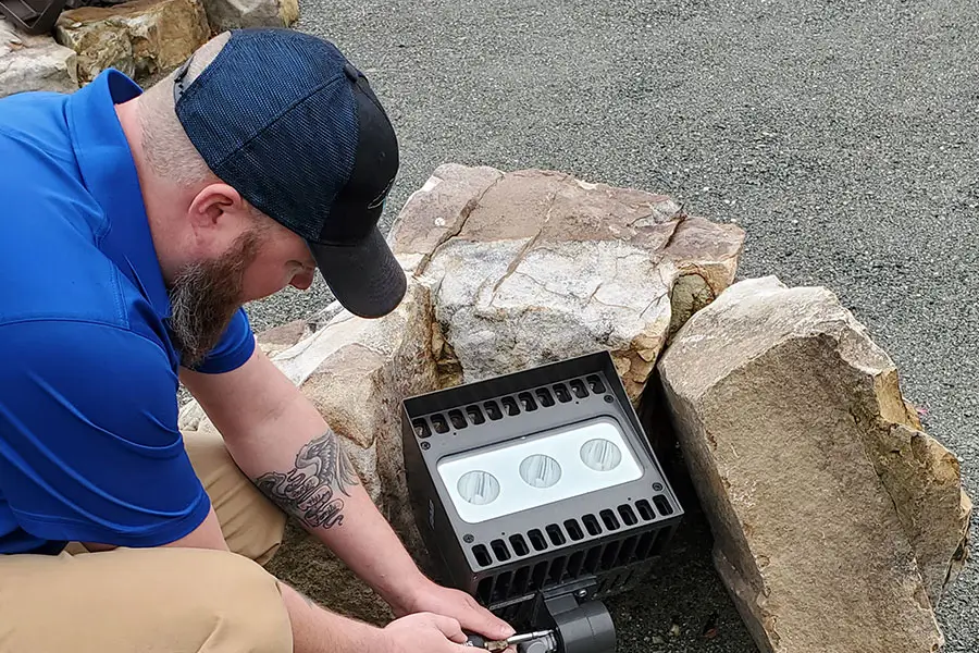 CMC Electric electrician connecting wiring for an outdoor landscape light