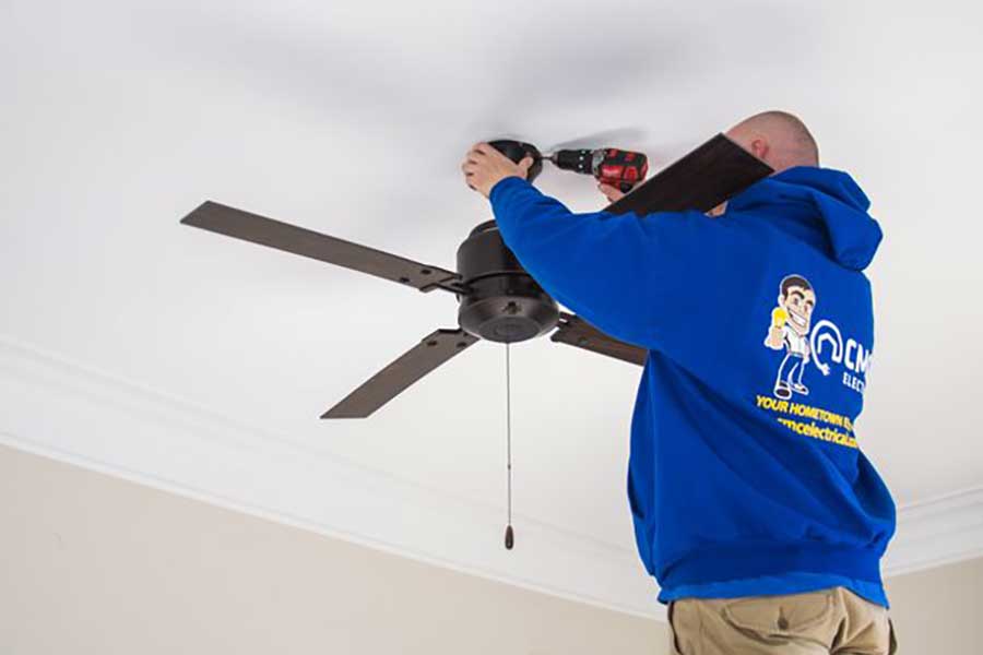Residential electrician installs ceiling fan in Clayton NC