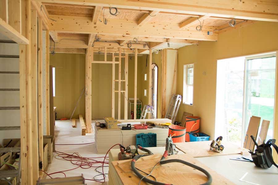 Interior of a home undergoing electrical rewiring in Raleigh, NC with exposed framing.