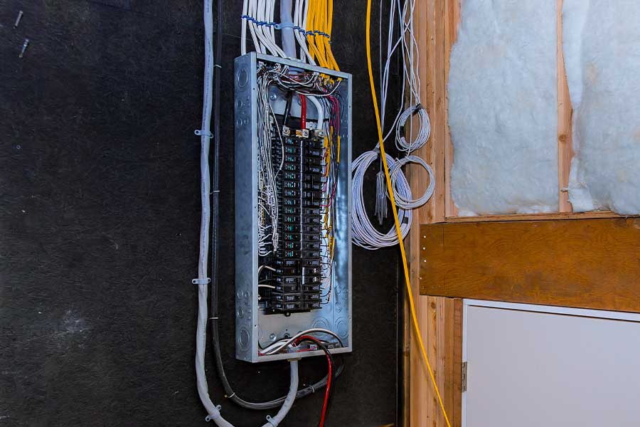 Electrical rewiring in Raleigh, NC with an upgraded electrical panel and organized wiring.