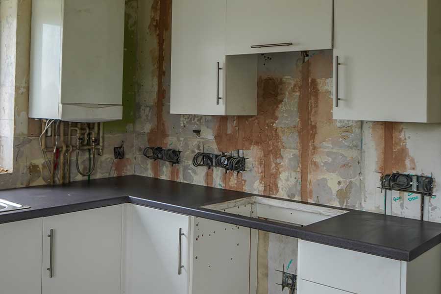 Electrical rewiring in progress during a residential kitchen remodel